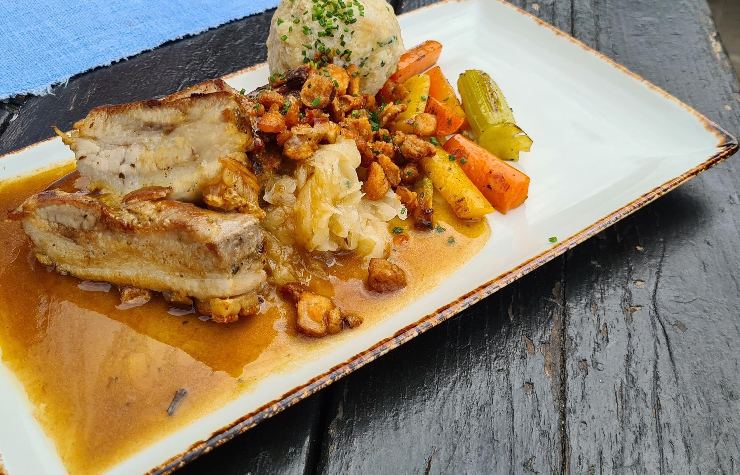 Roast pork with bread dumplings and vegetables