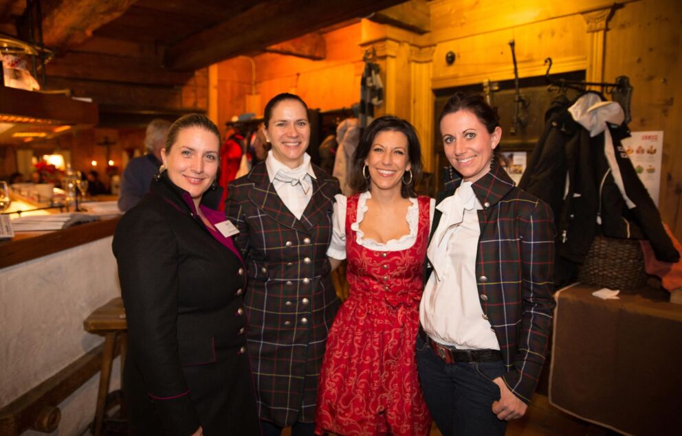 4 women in traditional dress pose at Trattlers Einkehr.