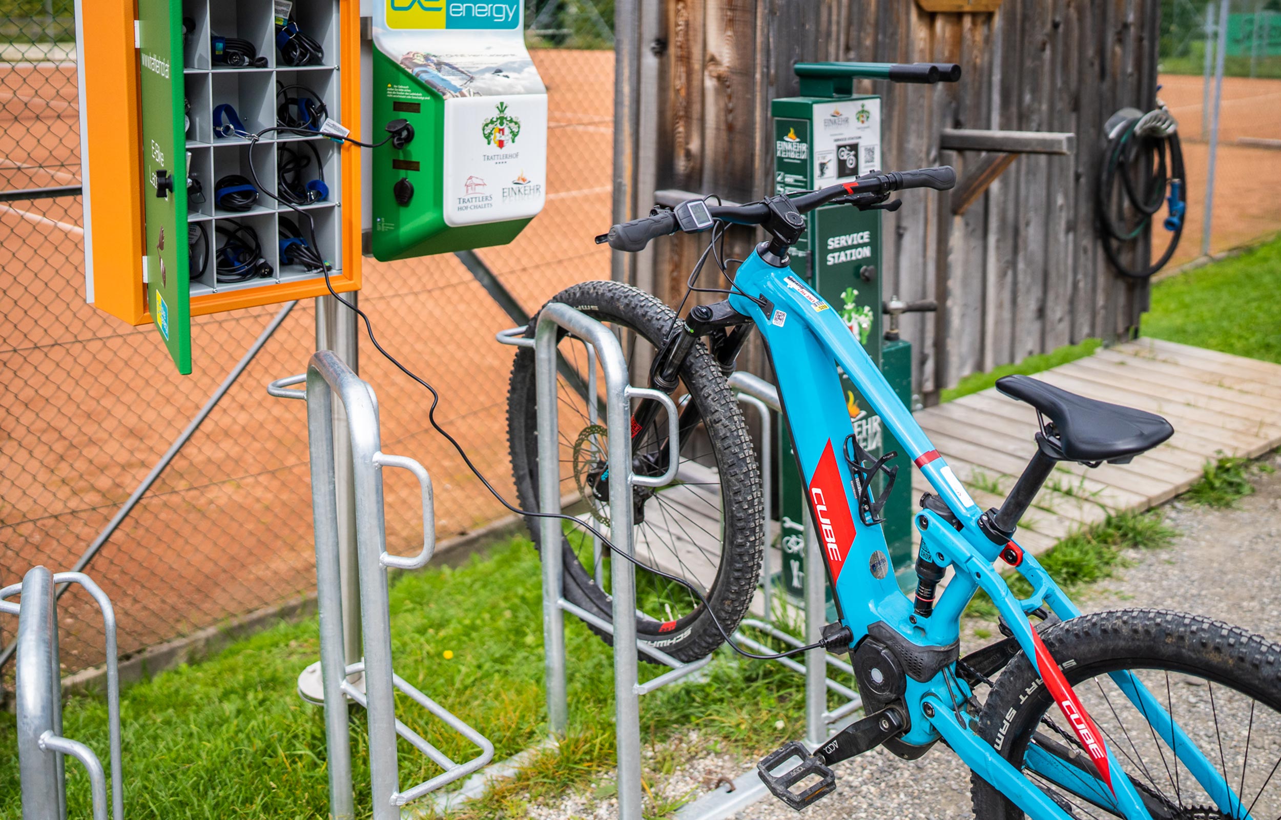 An e-bike in a bicycle stand at a charging station