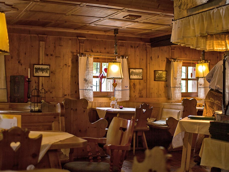 A rustic parlour with many wooden elements.